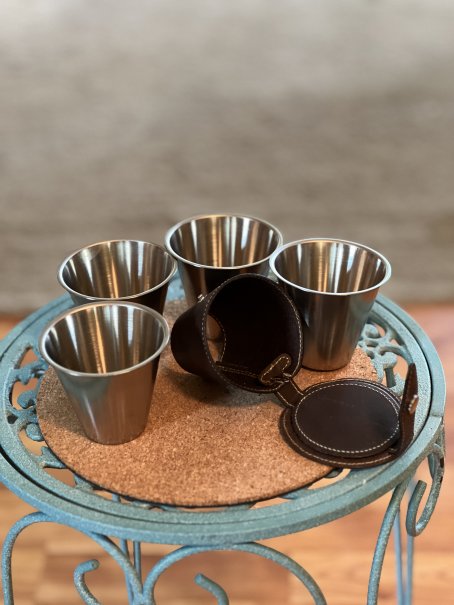 Small stainless steel cups in case - J. Peterman Co.